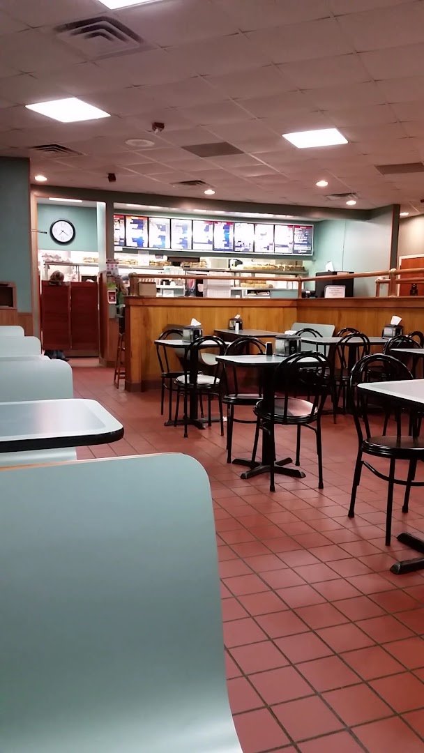 Family restaurant with outdoor seating and signage.