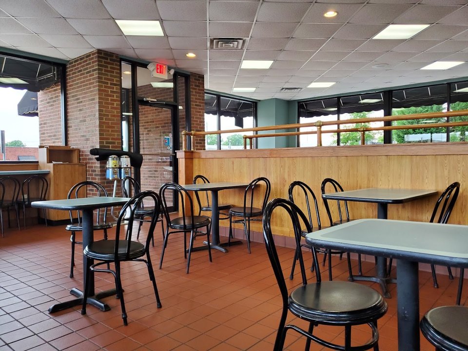 Family restaurant with outdoor seating and signage.