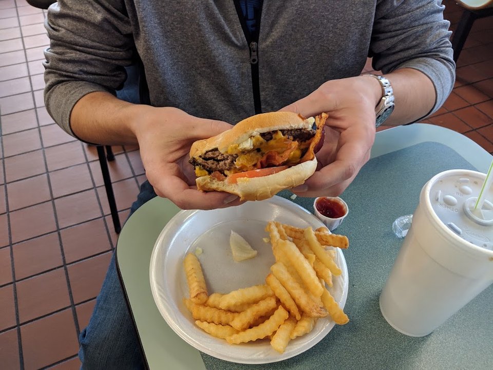 Hot dog and fries on a diner tray.